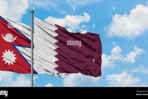 nepal-and-qatar-flag-waving-in-the-wind-against-white-cloudy-blue-sky-together-diplomacy-concept-international-relations-2AD138X